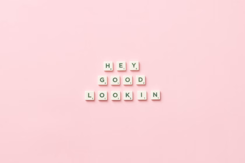a-friendly-word-of-welcome A playful message reading "HEY GOOD LOOKIN" sits in the center of a pink background.